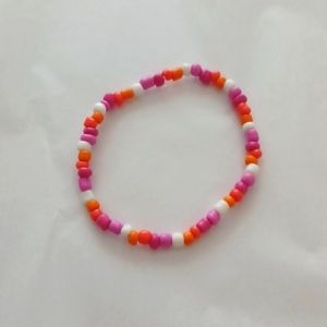 Handmade pink orange and white bracelet